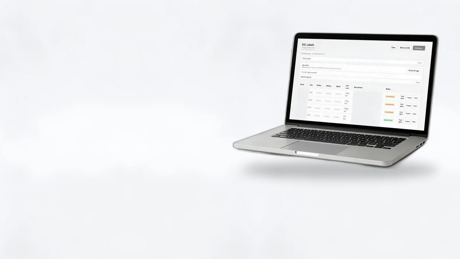 An open laptop showing the E-label.id dashboard with a table of shelf labels and their status.